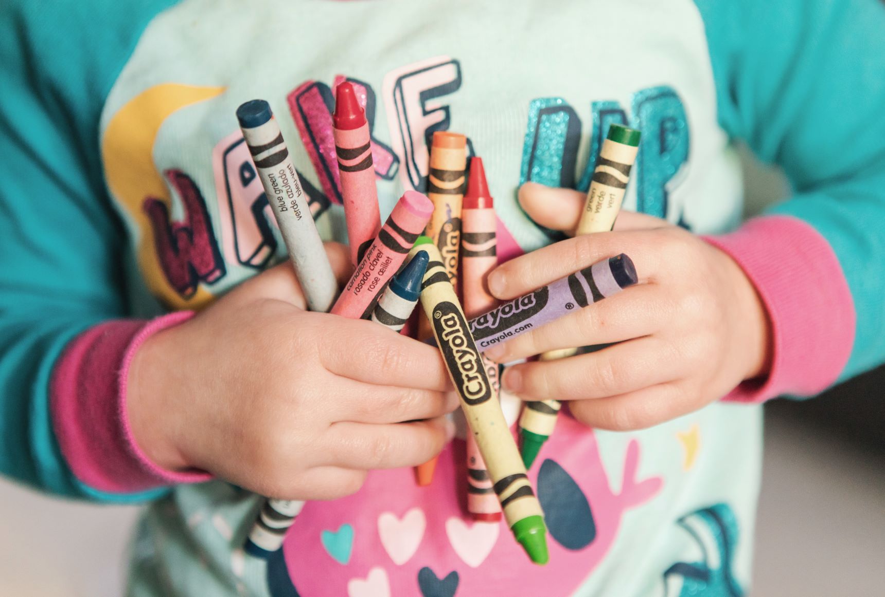 Toddler with crayons