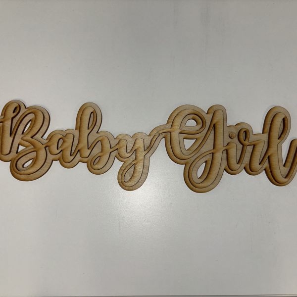 Double layer sign cut out on birch wood and then glued together. The top layer is Baby Girl in font downloaded from DaFont.com. The bottom layer is a thick offset made from the top layer.