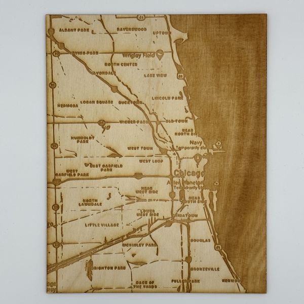 Snip of Chicago map etched onto birch wood.