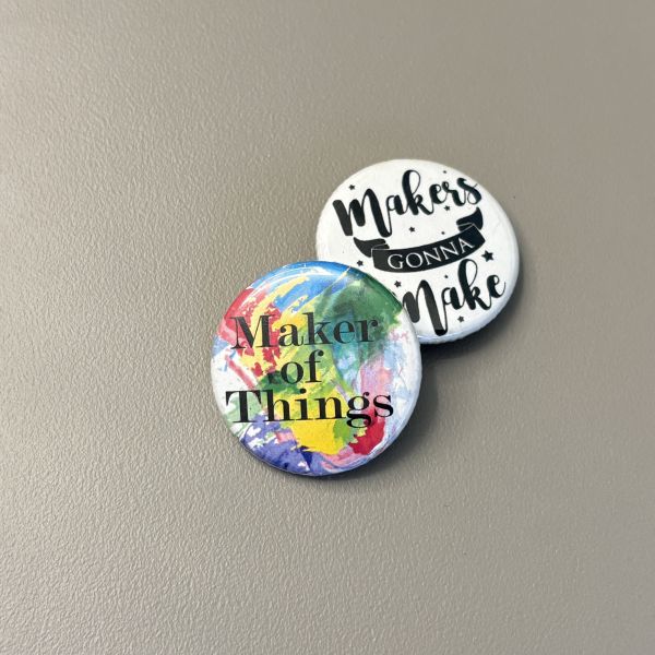 Two buttons, one that says Maker of Things with a splash of color, and the other says Makers Gonna Make in black and white.